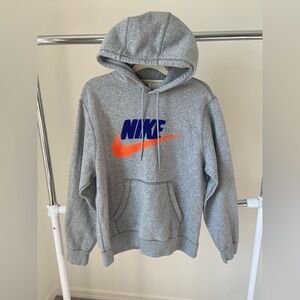 Nike Men’s Club Gray with Blue and Orange Logo Pull Over Hoodie.